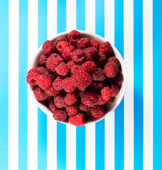 Raspberries on a striped background