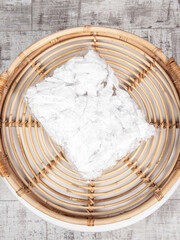 Set of disposable food storage lids. Cellophane bag from drying food on wooden background