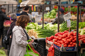 Open air street farmer market (pijaca) with freshly harvested fruit and vegetables in Belgrade,...