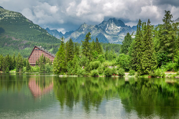 Fototapeta na wymiar Forest and mountain lake in Strbske Pleso in Slovakia
