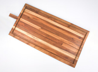 Wooden vegetable chopping board in white background