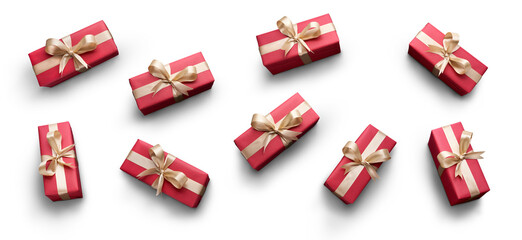 Top view of Christmas presents wrapped in red paper with gold ribbon and bow decoration isolated against a transparent background.
