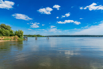 View to the old broken pier for boats and ferry on Volga River in Konakovo, Russia