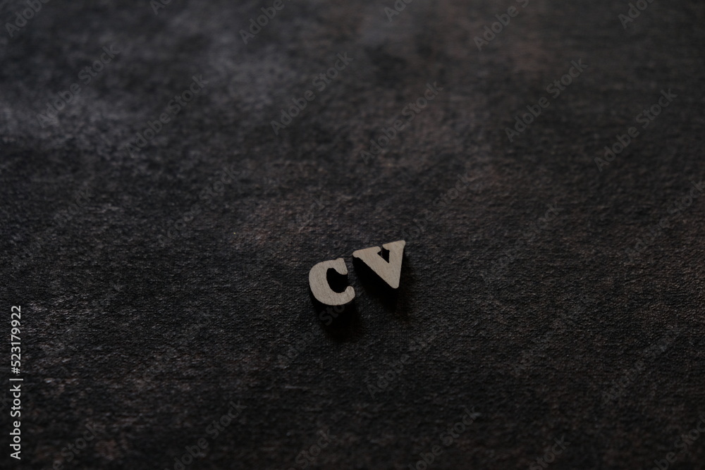 Fototapete the letters c and v above the dark field. initials cv