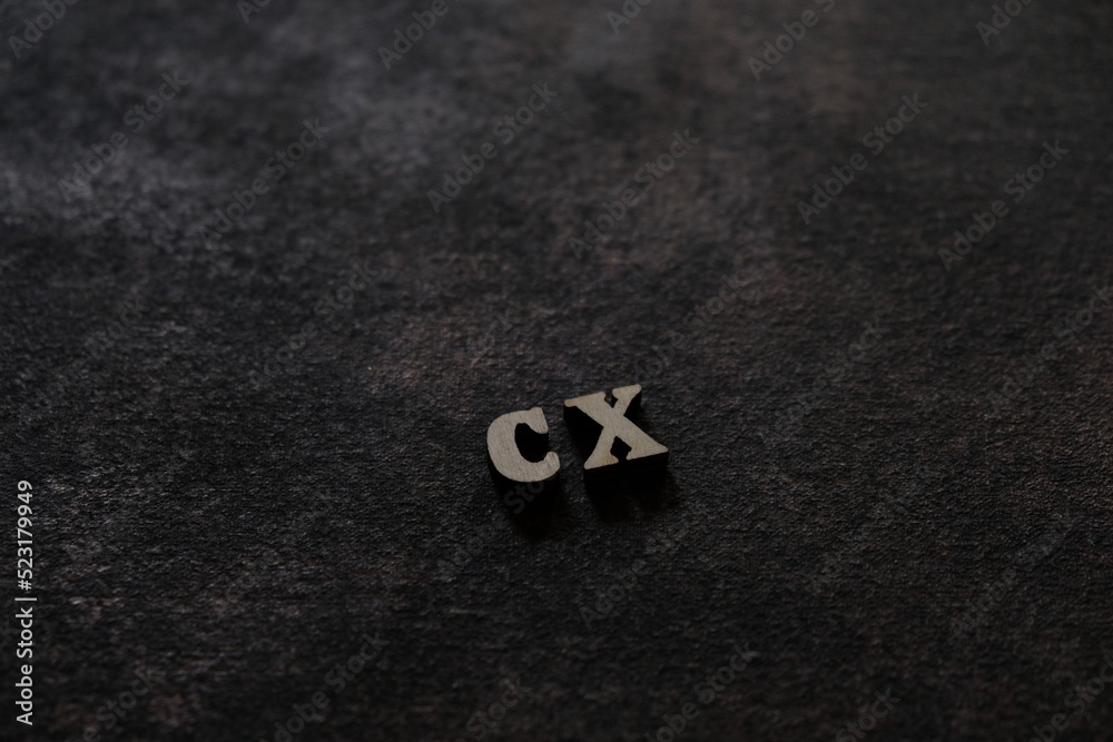 Fototapete the letters c and x above the dark field. initials cx