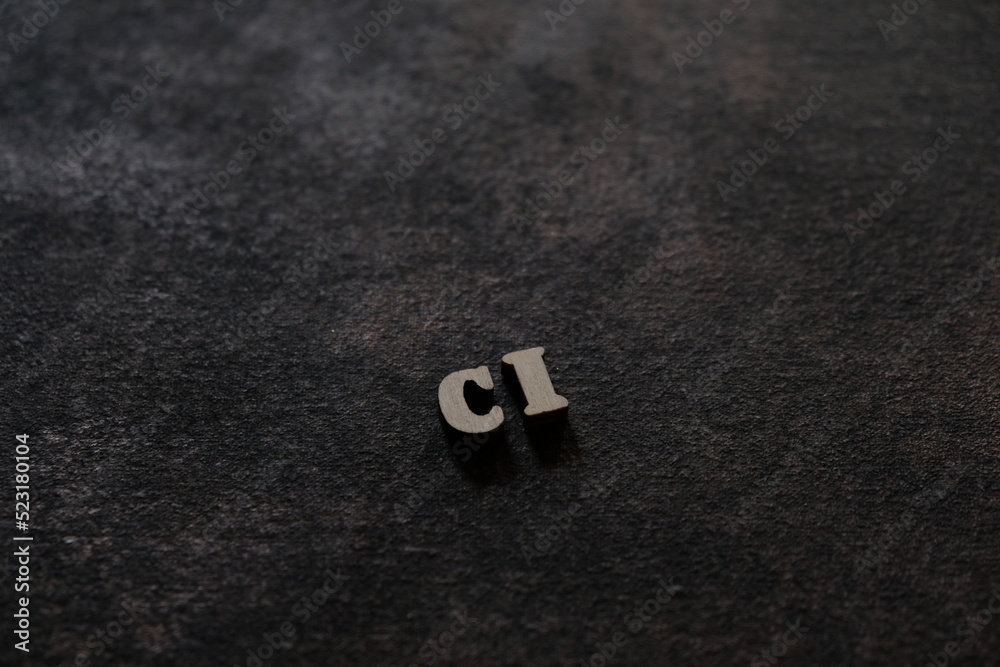Fototapete the letters c and i above the dark field. initials ci