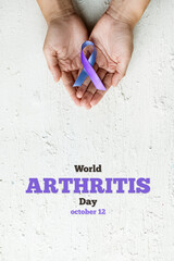 World Autoimmune Arthritis Day. Woman hands holding blue purple ribbon on white background. RA...