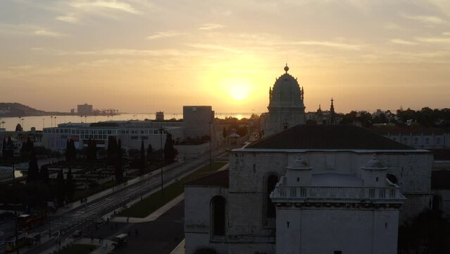 Aerial Downward Hot Of Jeronimos Monastery By Tagus River In City During Sunset - Lisbon, Portugal