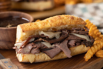 French dip sandwich and bowl of au jus - 523184532