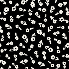 Cute little wild flowers with leaves seamless repeat pattern. Random placed, vector minimal botany all over surface print on black background.
