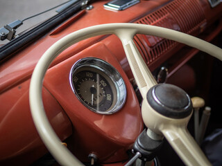 Dashboard and steering wheel of old-timer car - obrazy, fototapety, plakaty