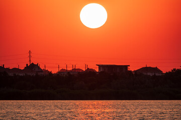 The sun goes down over a lake