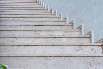 Empty stone staircase near white wall, abstract photo