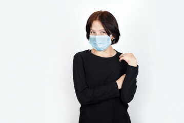 A young girl wore a medical mask on her face to avoid getting sick, after the recent virus...