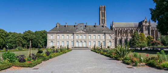 a large french style period building under a clear blue sky