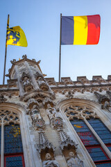 Belgian flags in Town hall, flemish architecture in Bruges, Belgium