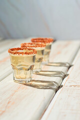 Mexican mezcal shot with chili pepper and orange