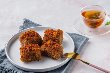 Biko is a sweet rice cake from the Philippines. It is made of coconut milk, brown sugar, ginger, and glutinous rice. It is usually topped with latik.