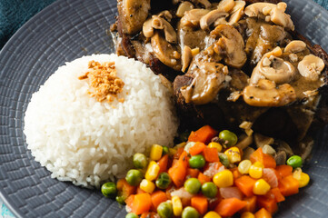 Bulalo Steak – is a famous Filipino dish where beef shanks are boiled then grilled topped with gravy mushroom sauce. 