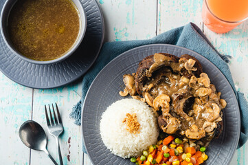 Bulalo Steak – is a famous Filipino dish where beef shanks are boiled then grilled topped with gravy mushroom sauce. 