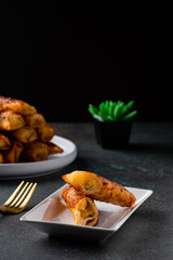 Turon is a popular Filipino snack that's sweet, crunchy, and satisfying. Ripe saba banana, jackfruit, and brown sugar are rolled together in a flour lumpia wrapper and fried to a golden crisp.