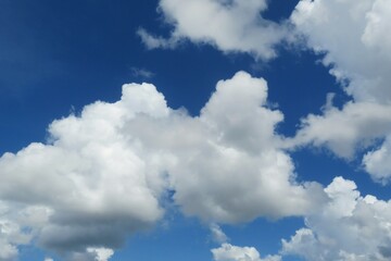 Naklejka na ściany i meble Blue sky with beautiful big fluffy clouds, natural background 