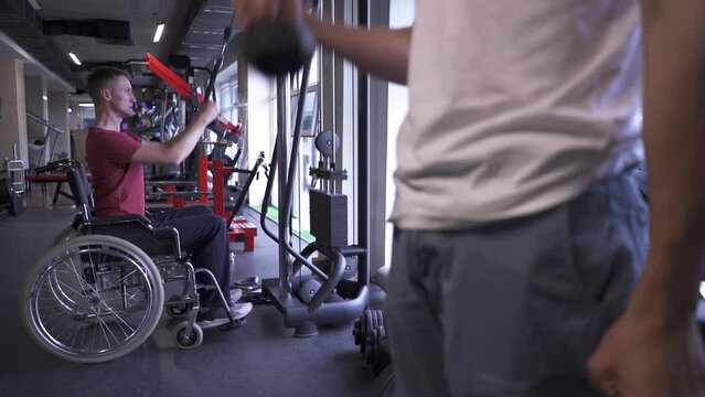 Man in a wheelchair working out at the gym