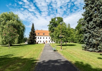Fototapeta na wymiar Landscape with Havirovsky zamecek Sumbark castle behind the trees in Czechia
