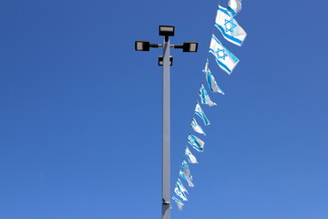 The blue and white Israeli flag with the Star of David.