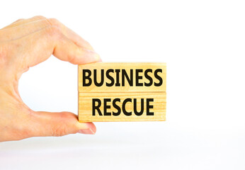 Business rescue symbol. Concept words Business rescue on wooden blocks on a beautiful white table...