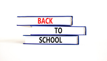 Back to school and support symbol. Concept words Back to school on books. Beautiful white table white background. Business, educational and Back to school quote concept. Copy space.