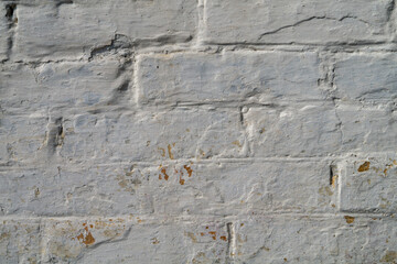Wall of a white brick house as a texture, brickwall pattern close-up as a background