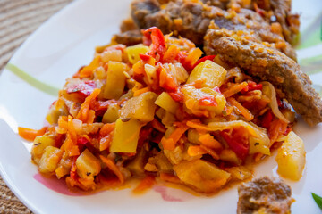 ratatouille, vegetable stew on a plate, diet food, keto recipe