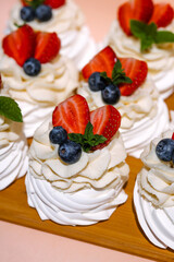 Gourmet pavlova cake with fresh berry topping.