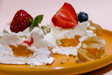 Gourmet pavlova cake with fresh berry topping.