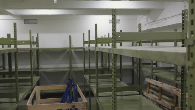 Empty Storage Room Warehouse With Green Shelf Rack pan