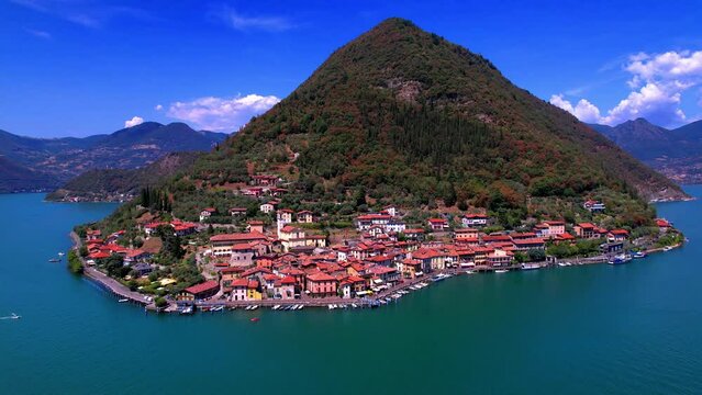 Italian lakes scenery. Iseo lake . Aerial drone view of beautiful Monte Isola island and Peschiera Maraglio village. Italy, Brescia province