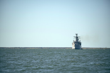 Fototapeta premium Warship sailing in still water