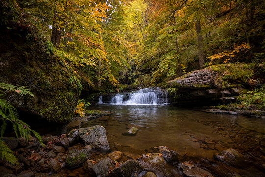 Scenic landscape in deciduous forest and waterfall in Sierra Cebollera in La Rioja, Spain, Puente Ra