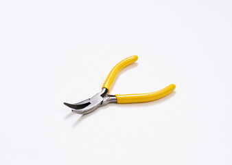 Yellow plier on white background