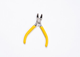 Yellow plier on white background