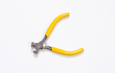 Yellow plier on white background