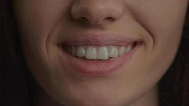 Close up of a caucasian woman confident smile in slow motion