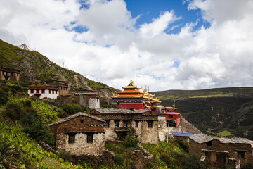 Tibetan monastery on a hill with monk quarters and main hall in Sichuan province