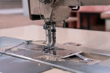 Sewing machine needles close-up in the workshop