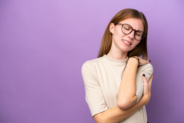 Young English woman isolated on purple background suffering from pain in shoulder for having made an effort