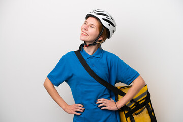 Young English woman with thermal backpack isolated on white background posing with arms at hip and smiling