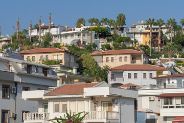 Low-rise houses located on a hill.