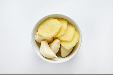 garlic and ginger in the white bowl