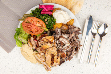 Meat and chicken mix Shawarma Doner on a plate, Meat and chicken mix Shawarma plate isolated on white background